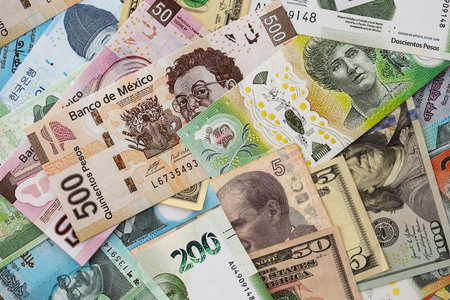 Big amount of money bills of different currencies and countries. Assortment background of...
