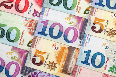 Georgian Lari currency money bills. GEL currency banknotes in pile with different denomination close...