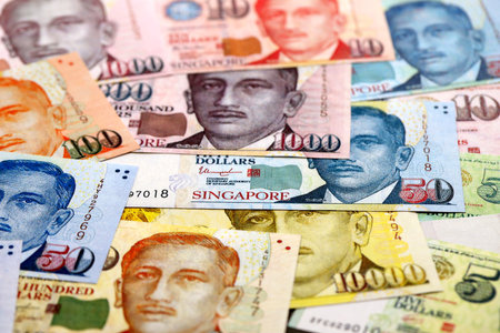 Singapore Dollar currency money bills. SGD currency banknotes in bunch with different denomination...