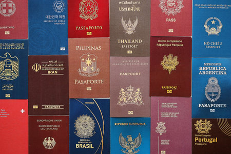 Big amount of biometrical passports from various different countries close upの写真素材