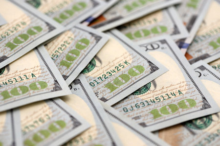 United States Dollar currency money bills. USD currency banknotes in big amount with different...