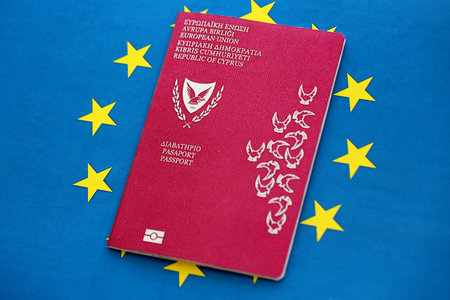 Kyprus passport on European union blue flag background close up. Citizenship in countries of Europe conceptの写真素材