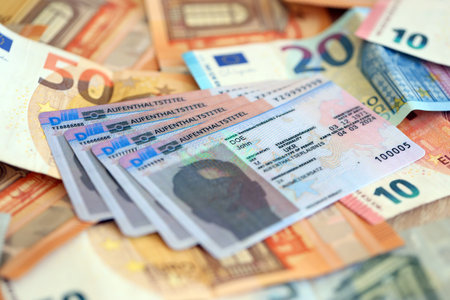 German Permanent resident card with euro money bills close up. Aufenthaltstitelの写真素材