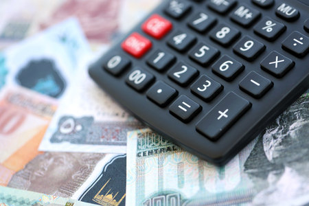 Egyptian pound currency money bills and calculator close up. The concept of taxation and money countの写真素材