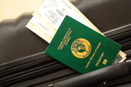 Nigerian passport and avia tickets on travel bag close up. The concept of travel and vacationの写真素材