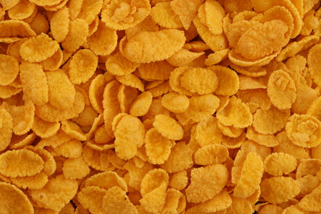 Corn flakes background and texture close up. Top view cornflake cereal box for breakfast