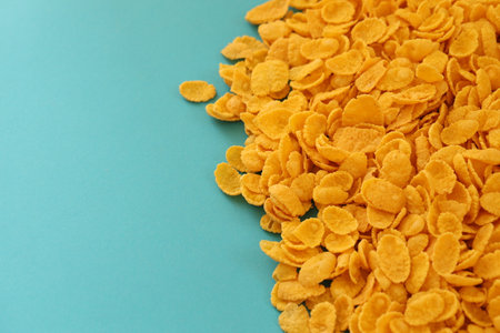 Background of breakfast cereals in big amount on blue background close up, top viewの写真素材