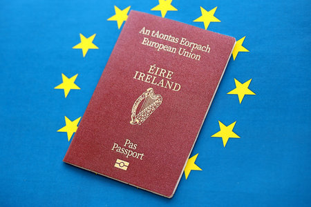 Ireland passport on European union blue flag background close up. Citizenship in countries of Europe conceptの写真素材