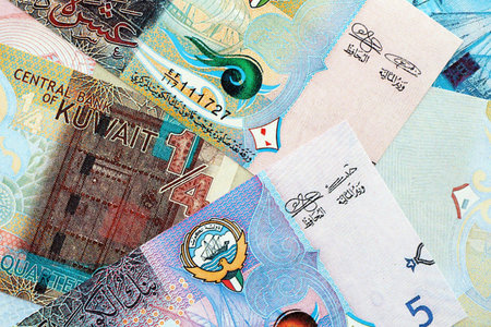 Kuwaiti dinar currency money bills. The current banknotes lies on table in big amount close up