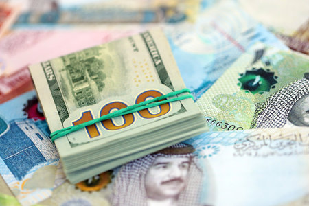 Bahraini dinar currency money bills and bunch of us dollar banknotes close up. The concept of...