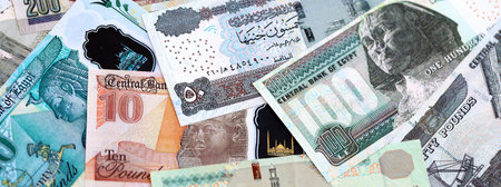 Egyptian pound currency money bills. The current banknotes lies on table in big amount close up