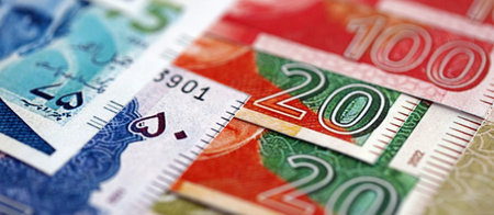 Pakistan rupees banknotes close up. The current Pakistan money bills lies on table in big amount....