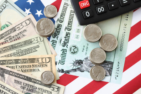 American US dollars money bills and calculator on American flag close up. Money investment concept...