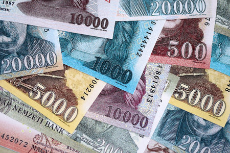 Hungarian Forints currency money bills in big amount. Many HUF currency banknotes with different...
