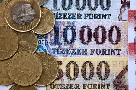 Pile of Hungarian Forint currency money bills and coins. HUF currency banknotes and coins close up