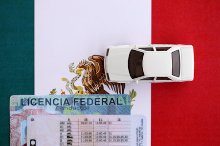 Mexican driving permit concept. Toy car and driver license on flag close upの写真素材