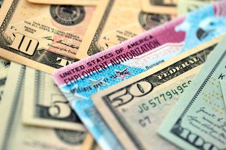 American US dollars money bills with employment authorization card close up