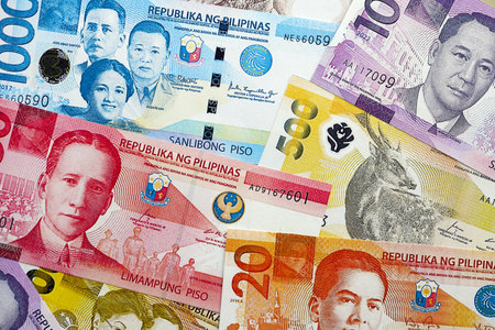 Philippines peso currency money bills. The current banknotes lies on table in big amount close upの写真素材