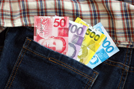 Philippines peso money bills in denims pocket close up. The concept of fashion and wealthの写真素材