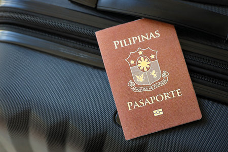 Philippines passport on travel luggage close up. The concept of travel and vacationの写真素材