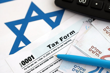 Israel new shekels money with calculator and tax form on flag. The current Israel money and tax...