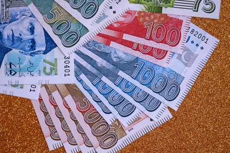 Pakistan rupees banknotes on golden yellow background. The current Pakistan money bills lies on...