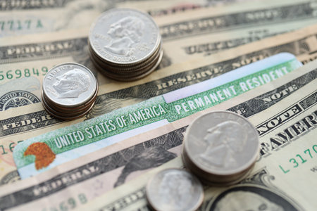 American US dollars money bills, green card close up. Taxpaying and insurance concept