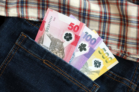 Philippines peso money bills in denims pocket close up. The concept of fashion and wealthの写真素材