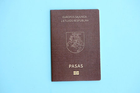 Lithuania passport on light blue paper background close up. Citizenship and travel in Europe conceptの写真素材