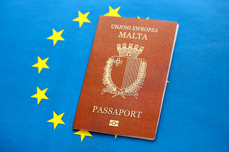 Malta passport on European union blue flag background close up. Citizenship in countries of Europe conceptの写真素材