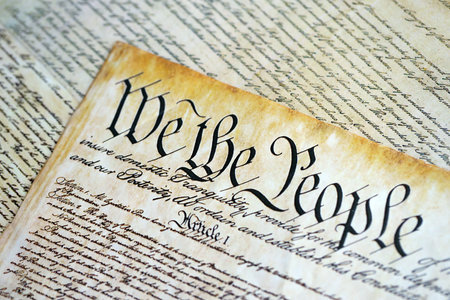 A parchment of the Constitution of the United States. We the people, the beginning of the preamble to the United States constitution close upの写真素材
