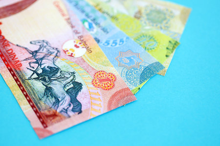 Bahraini dinar money bills in big amount on blue close up. Finance and banking conceptの写真素材