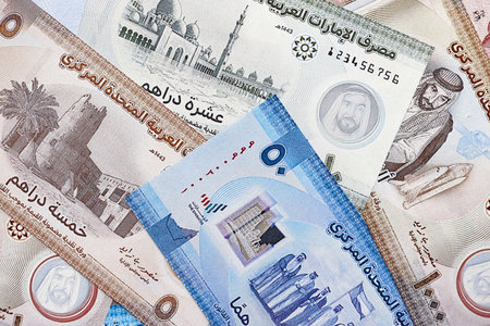 United Arab Emirates dirham currency money bills. The current banknotes lies on table in big amount close upの写真素材