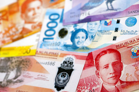Philippines peso currency money bills. The current banknotes lies on table in big amount close up