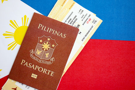 Philippines passport and boarding pass tickets on flag close up. The concept of travel and vacationの写真素材
