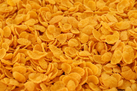 Corn flakes background and texture close up. Top view cornflake cereal box for breakfast