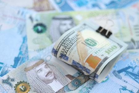 Bahraini dinar currency money bills and bunch of us dollar banknotes close up. The concept of economics and currency exchangeの写真素材