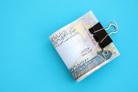 Bahraini dinar money bills in big amount on blue close up. Finance and banking conceptの写真素材