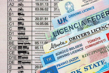 Driving licenses from different countries and American states. Concept of obtaining driving permitの写真素材