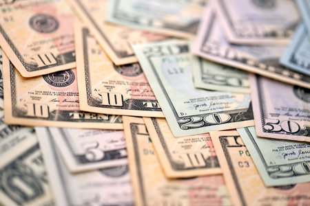 United States Dollar currency money bills. USD currency banknotes in pile with different denomination close upの写真素材