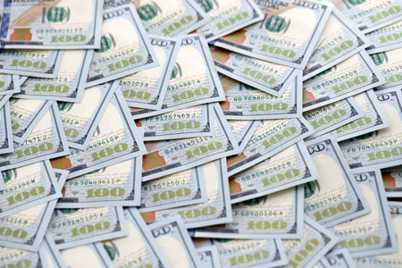 United States Dollar currency money bills. USD currency banknotes in big amount with different...