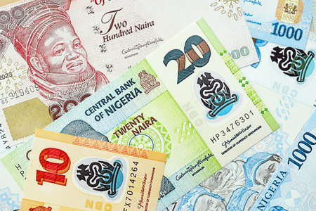 Nigerian naira currency money. The current banknotes lies on table in big amount close up