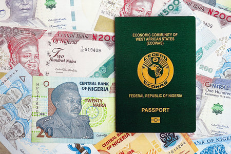 Nigerian naira currency money bills and passport close up. The concept of travel and vacation