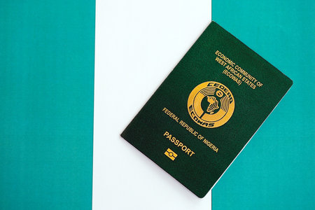 Nigerian passport on flag close up. The concept of citizenshipの写真素材
