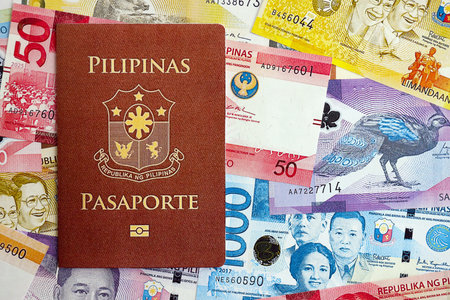 Philippines peso currency money bills and passport close up. The concept of travel and vacationの写真素材