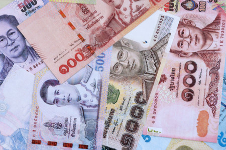 Thai baht currency money. The current banknotes lies on table in big amount close up