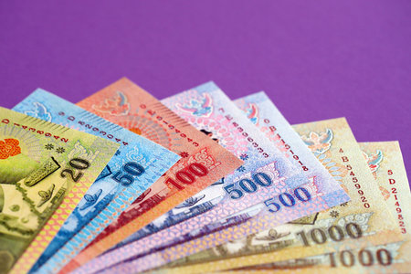Thai baht money bills in big amount on purple close up. Finance and banking conceptの写真素材