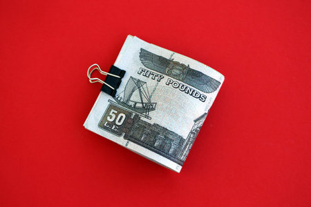 Egyptian pound money bills in big amount on red close up. Finance and banking conceptの写真素材