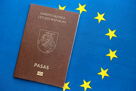 Lithuania passport on European union blue flag background close up. Citizenship in countries of Europe conceptの写真素材