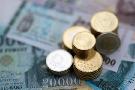 Heap of Hungarian Forint currency money bills and coins. HUF currency banknotes and coins close upの写真素材